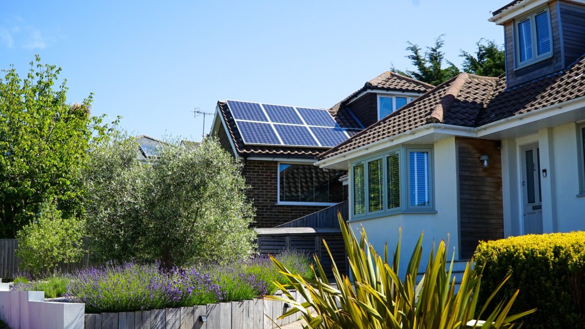 An image of a house with solar panels